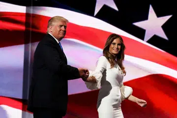 SOKONGAN DARI ISTERI: Encik Donald Trump bersama isterinya, Cik Melania, selepas isterinya menyampaikan ucapan sewaktu Konvensyen Nasional Republikan, semalam. - Foto-foto AFP