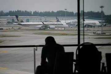SIAP BANGKIT SEMULA: Dengan status lapangan terbang Changi serta kekuatan tenaga kerja, sektor udara Singapura yakin dapat bangkit lebih gagah dalam beberapa tahun mendatang. - Foto fail