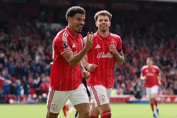 Pemain Nottingham Forest, Morgan Gibbs-White (kiri), meraikan gol ketiga beliau buat pasukan, bersama pemain pertahanan Neco Williams, dalam perlawanan menentang Burnley di The City Ground, Nottingham, Britain, pada 19 April.