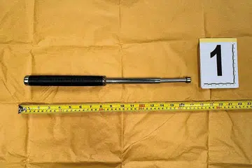 DIRAMPAS: Sebatang baton yang boleh dipanjangkan telah dirampas di tempat kejadian sebagai bahan bukti kejadian serangan ke atas pelakon Malaysia, Kamal Adli, pada Ahad lalu semasa sesi bergambar bersama peminat di Dewan 5, Singapore Expo. - Foto SPF
