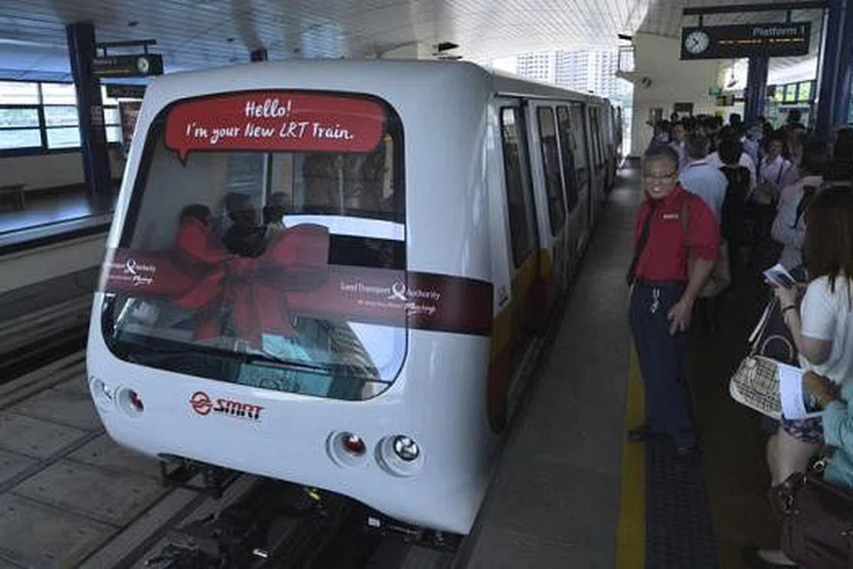 MENAMBAH KESELESAAN PENGGUNA: Dua daripada 13 kereta api LRT baru mula beroperasi di stesen LRT Bukit Panjang, semalam. - Foto-foto THE STRAITS TIMES 