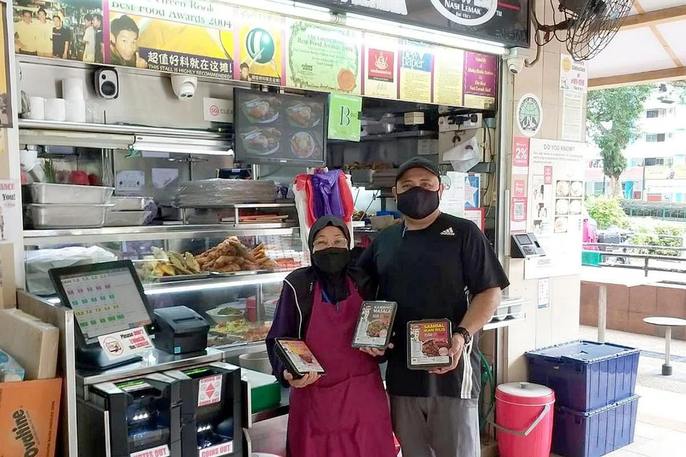 TERJEJAS SEDIKIT: Perniagaan Boon Lay Power Nasi Lemak terjejas sedikit selepas sempadan ke Malaysia dibuka. - Foto fail