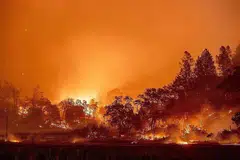 KEBAKARAN MEREBAK GANAS: Kebakaran liar mengganas dan merebak di kawasan Napa County's St. Helena, California, Amerika Syarikat. Gambar menunjukkan bukit-bukau yang telah terbakar di kawasan itu dalam tempoh satu malam pada hujung September lalu. - Foto AFP