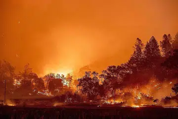 KEBAKARAN MEREBAK GANAS: Kebakaran liar mengganas dan merebak di kawasan Napa County's St. Helena, California, Amerika Syarikat. Gambar menunjukkan bukit-bukau yang telah terbakar di kawasan itu dalam tempoh satu malam pada hujung September lalu. - Foto AFP