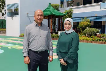 Guru yang menyumbang kepada budaya penyayang di Sekolah Rendah Telok Kurau (TKPS), Encik Shaharzad Kasman, dan Cik Arafah Tajudin, mengimbau kembali pengalaman mereka di sekolah tersebut sempena ulang tahun ke-100 TKPS.