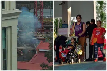 Asap kelihatan berdekatan Jiak Kim Street ekoran pelupusan bom Perang Dunia Kedua pada 18 November 2019, setelah penduduk mengosongkan rumah mereka pagi tadi. - Foto-foto ST oleh NG SOR LUAN
