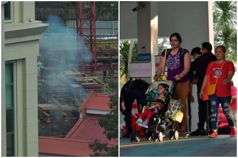 Asap kelihatan berdekatan Jiak Kim Street ekoran pelupusan bom Perang Dunia Kedua pada 18 November 2019, setelah penduduk mengosongkan rumah mereka pagi tadi. - Foto-foto ST oleh NG SOR LUAN