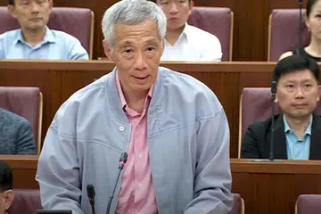 PENUH YAKIN: Perdana Menteri Encik Lee Hsien Loong berkata beliau yakin terhadap kededua menterinya, Encik K. Shanmugam dan Dr Vivian Balakrishnan. 
