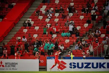 SENTUHAN HEBAT: Ikhsan meraikan golnya semasa membantu Singa membuka tirai kejohanan dengan kemenangan di hadapan lebih 7,500 penyokong di Stadium Negara malam kelmarin. - Foto-Foto BH oleh JASON QUAH