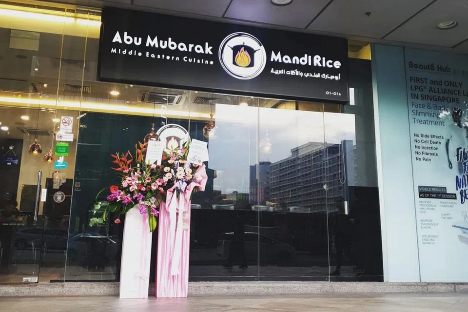BARU DIBUKA SEBELUM PEMUTUS LITAR: Restoran Abu Mubarak Mandi Rice baru dibuka pada 1 April lalu di bangunan Income at Tampines Junction tetapi terpaksa ditutup buat sementara waktu selepas langkah pemutus litar berkuat kuasa. - Foto ABU MUBARAK MANDI RICE