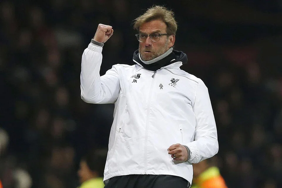 WAJAH KEMENANGAN: Juergen Klopp meraikan kejayaan pasukannya melangkah ke suku akhir Liga Europa selepas seri 1-1 dengan United dinihari semalam. Liverpool menang pertemuan pertama 2-0. - Foto REUTERS