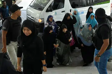 Seorang daripada empat anak pengasas Al-Arqam yang juga isteri kepada Ketua Pegawai Ekselutif (CEO) Global Ikhwan Holdings Sdn Bhd (GISBH), antara 19 yang dibawa ke Mahkamah Majistret Shah Alam untuk mendapatkan perintah reman selama tujuh hari, bermula pada 19 September.