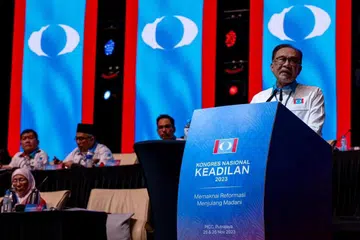 KERAJAAN KUKUH: Perdana Menteri Malaysia merangkap Presiden Parti Keadilan Rakyat (PKR), Datuk Seri Anwar Ibrahim, berucap semasa Kongres Nasional PKR 2023 di Pusat Konvensyen Antarabangsa Putrajaya (PICC), pada Ahad.