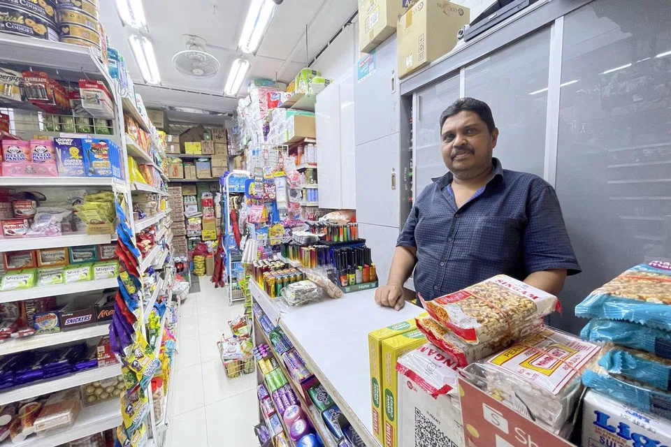 TERUSKAN PERNIAGAAN: Encik Mohamed Ismail mengambil alih kedai runcit HJ Mart daripada bapanya sekitar 16 tahun lalu. Kedai itu telah bertapak di Bishan Street 11 lebih tiga dekad.