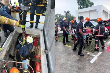 DISELAMATKAN: Lima pegawai Pasukan Pertahanan Awam Singapura (SCDF), termasuk seorang paramedik, menuruni tangga ‘cat ladder’ untuk sampai kepada lelaki yang tercedera selepas jatuh ke dalam bilik pam pemercik pada 28 November.