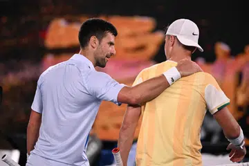 BERI PUJIAN: Pemain nombor satu dunia, Novak Djokovic (kiri), memuji pemain remaja asal Croatia, Dino Prizmic, selepas menewaskan remaja itu dalam perlawanan sulungnya dalam pusingan pertama Terbuka Australia pada 14 Januari.