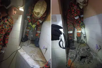PENEMUAN NGERI: Bomba dan Penyelamat Selangor mengambil masa lebih dua jam untuk memecahkan kolam air sebelum menemui mayat wanita yang ditanam dan disimen di sebuah rumah di Pandamaran. 