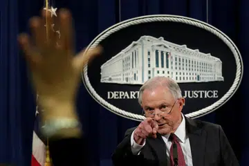 BERCAKAP KEPADA MEDIA: Encik Jeff Sessions semasa satu sidang akhbar di Jabatan Keadilan di Washington, kelmarin. - Foto REUTERS