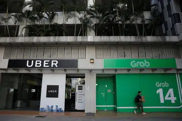 SAINGAN DALAM INDUSTRI PENGANGKUTAN: Tindakan Uber berundur bukan hanya menjejas pemandu tetapi juga kakitangan syarikat itu di seluruh Asia Tenggara. - Foto REUTERS