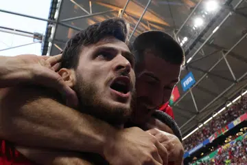 Penyerang Georgia, Khvicha Kvaratskhelia, meraikan gol pertama menentang Portugal dalam perlawanan Kumpulan F Euro 2024 pada 27 Jun. Perlawanan itu menyaksikan Georgia menang 2-0.
