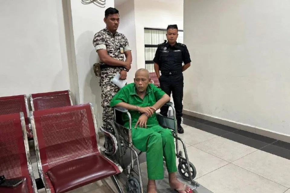 Azman Mohamed Nor berkerusi roda akibat penyakit saraf didakwa di Mahkamah Tinggi Muar pada 9 Julai atas tiga tuduhan membunuh.