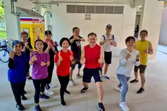 Cik Shaedah Dawood (depan, paling kiri, berbaju biru) kini menyertai kegiatan yang ada di Pusat Penuaan Aktif NTUC Berhad (Pasir Ris Central) sebanyak enam kali seminggu selama sekitar sejam setiap hari.