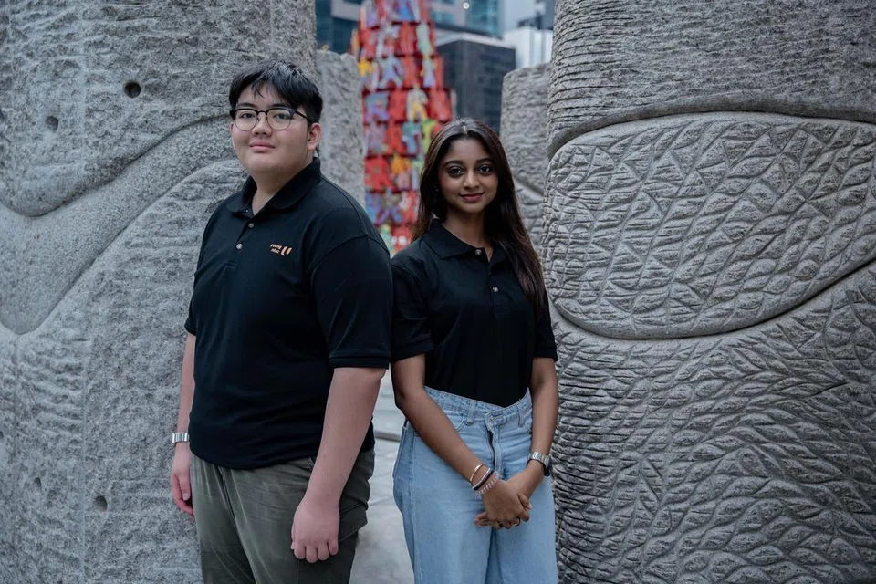 Encik Salimul Fikri Mohammad Salman (kiri) dan Cik Shafrin Farzana Shaik Dawood (kanan) terlibat dalam sambutan Perbarisan Hari Kebangsaan (NDP) 2024 untuk kali pertama.