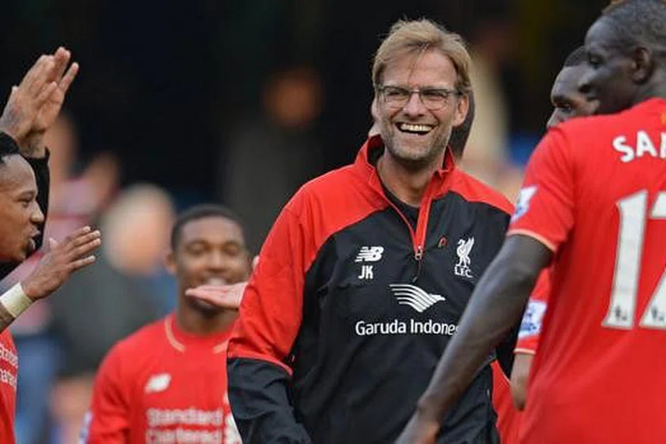 KEKALKAN MOMENTUM: Juergen Klopp (tengah) dan pemainnya perlu mengekalkan momentum kemenangan apabila bertandang ke Rubin Kazan. - Foto REUTERS