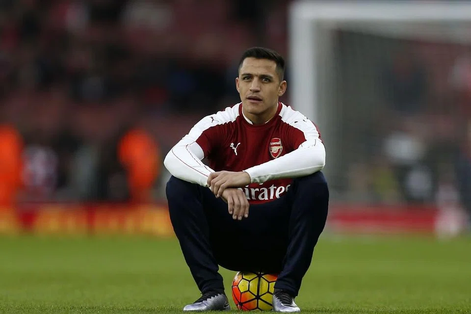 PELUANG BELUM TERTUTUP: Penyerang Arsenal yang berasal dari Chile, Alexis Sanchez, yakin pasukannya memiliki pemain yang mampu menjadi juara. 