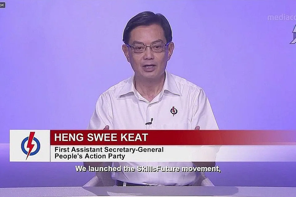 BENTANG KEUTAMAAN SELAMATKAN NYAWA, LINDUNGI PEKERJAAN: Timbalan Perdana Menteri Heng Swee Keat berucap di Siaran Politik Parti pertama PAP dalam Pilihan Raya Umum 2020 (GE2020) yang ditayangkan di televisyen malam tadi. - Foto TANGKAP LAYAR MEWATCH