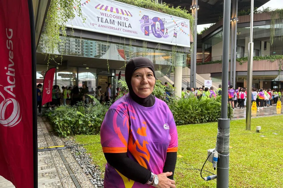 Cik Nun Zairina Indun, 69 tahun, berbangga dapat membantu Singapura melalui kerja sukarelawan Team Nila.  