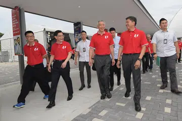 RAPAT TAHUN LALU: (Dari kiri) Pemimpin kesatuan Encik Tan Hock Soon; Timbalan Perdana Menteri Heng Swee Keat, Perdana Menteri Lee Hsien Loong, dan Setiausaha Agung NTUC Ng Chee Meng di Downtown East bagi Rapat Hari Pekerja pada 1 Mei 2019.