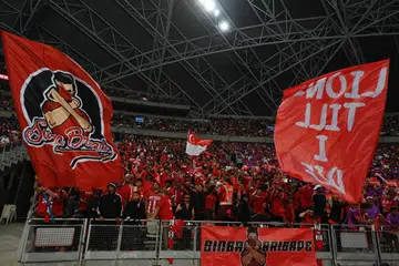 Kumpulan penyokong bola sepak Singapura, Singa Brigade, melaungkan sorakan kepada pasukan Singa dalam aksi kelayakan Piala Dunia menentang Korea Selatan di Stadium Negara pada 6 Jun.