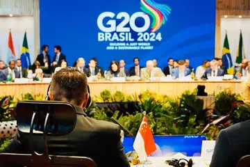 Dr Maliki Osman (membelakangi kamera) di Mesyuarat Menteri Pembangunan G20 (DMM) di Rio de Janeiro, Brazil.