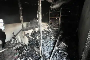Bekalan perubatan yang terbakar berselerak di dalam bilik simpanan Hospital Kamal Adwan di Beit Lahya, utara Jaluran Gaza, yang terkena peluru serangan udara Israel pada 31 Oktober. 