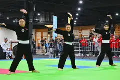 Pasukan regu lelaki Singapura yang terdiri daripada (dari kiri) Muhammad Affiz Mohamed Zakri; Muhammadinil Mustafar Mohd Isa dan Muhammad Nazrul Mohd Kamal, meraih pingat perak selepas tewas 9.965 - 9.935 di final acara regu putra kepada pasukan Indonesia di Dewan Forum Impact, Bangkok pada 14 Disember.