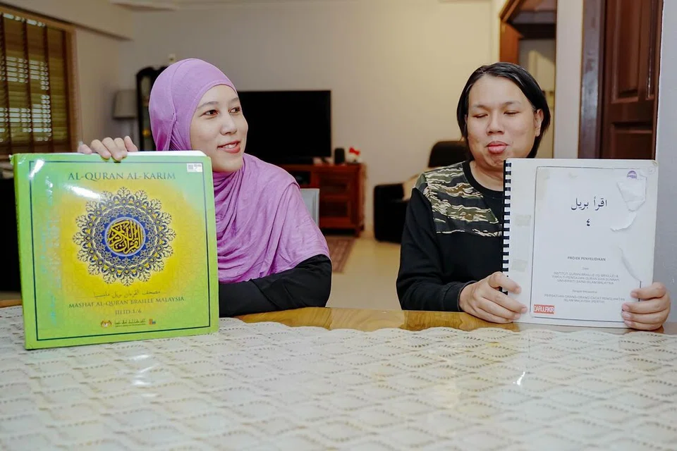 Dulu sekadar mendengar dan menghafal bacaan surah, Encik Iskandar (kanan) dan Cik Nuraziana kini mampu membaca kitab suci secara berdikari menggunakan Al-Quran Braille.