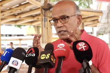 K. Shanmugam, serangan siber, telekomunikasi, AI