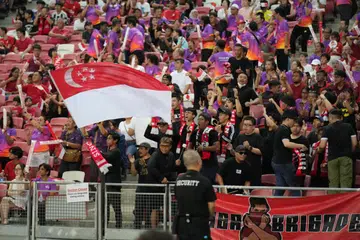 BERI SOKONGAN: Seramai 10,355 penyokong, termasuk 1,000 relawan Team Nila, menghadiri perlawanan pusingan pertama kelayakan Piala Dunia Singapura menentang Guam di Stadium Negara pada 12 Oktober.