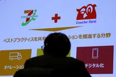 The Nikkei was down with 7-Eleven owner Seven & i Holdings plunging more than nine per cent at one point after Canada’s Alimentation Couche-Tard withdrew its US$47 billion offer for the firm.