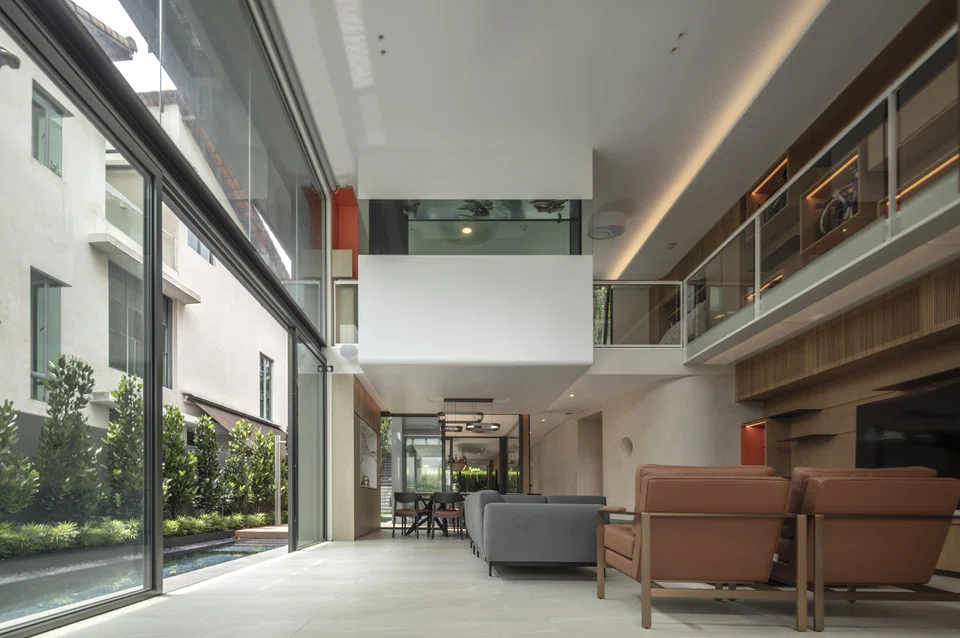 A fish tank above the living area showcases rare fish.