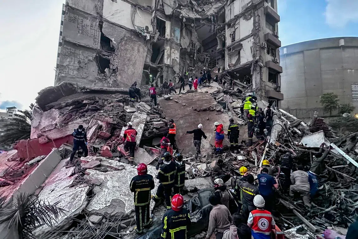 First responders in Beirut search for missing people at a residential building hit by an Israeli air strike on Wednesday (Apr 8). 