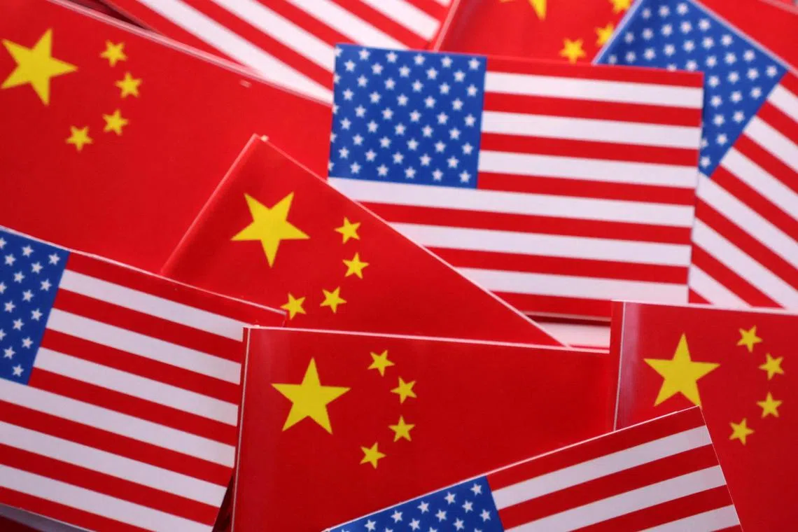U.S. and Chinese flags are seen in this illustration taken March 20, 2025. REUTERS/Dado Ruvic/Illustration 