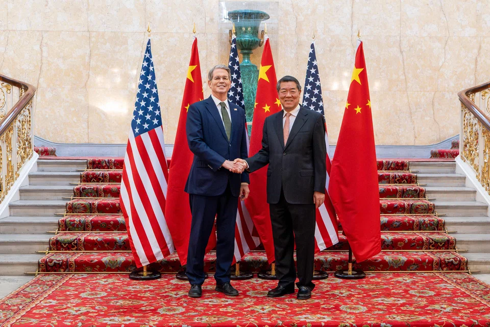 (From left) US Secretary of Treasury Scott Bessent and Chinese Vice-Premier He Lifeng shake hands as they pose for a photo during trade discussions at the Lancaster House in London, Britain, June 9, 2025. 