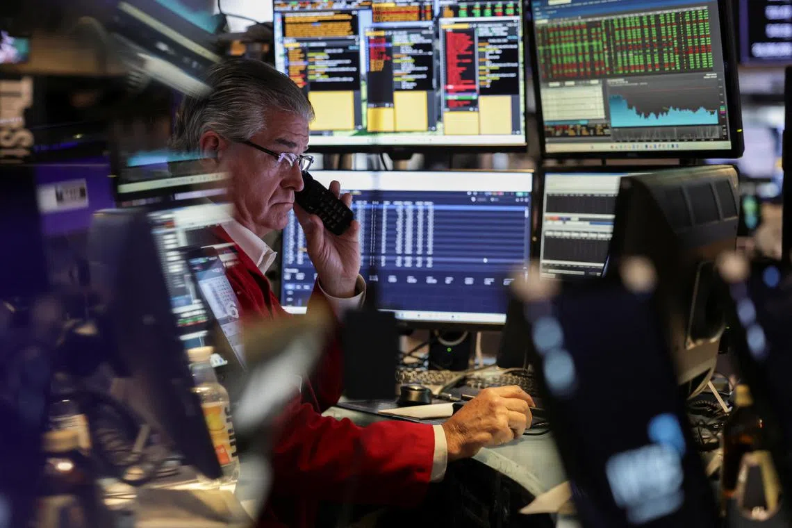 A trader works on the floor at the New York Stock Exchange (NYSE) in New York City, U.S., July 1, 2025. REUTERS/Jeenah Moon