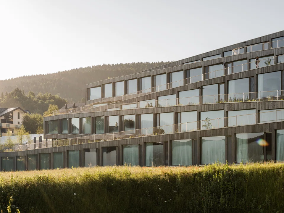 Hotel Des Horlogers' avant-garde architecture is inspired by the topography of Vallée de Joux. Zig-zagging slabs lead down into the meadows behind the hotel.