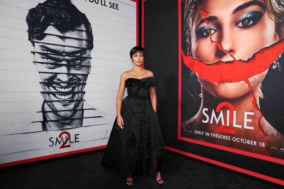 Actress Naomi Scott, who stars in 'Smile 2', arrives for a film premiere in Los Angeles, California, Oct 14, 2024. 