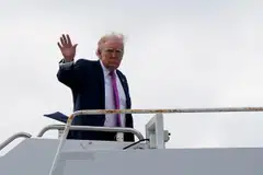 US President Donald Trump waves as he boards Air Force One at Palm Beach International Airport in West Palm Beach, Florida, March 29, 2026. 