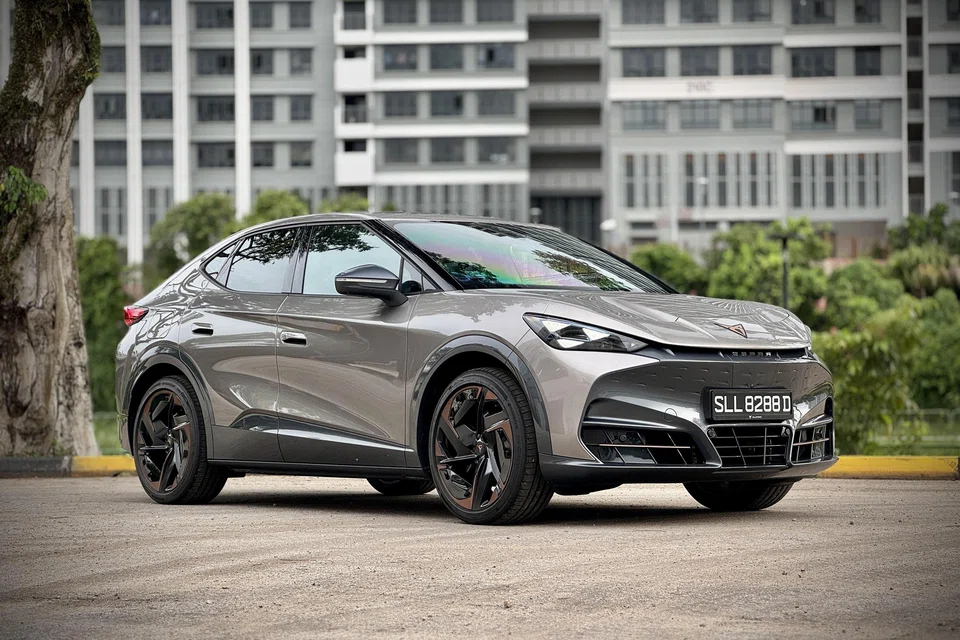 The Cupra Tavascan is a dramatic, brooding machine with sculpted haunches and a glowing crest.


 