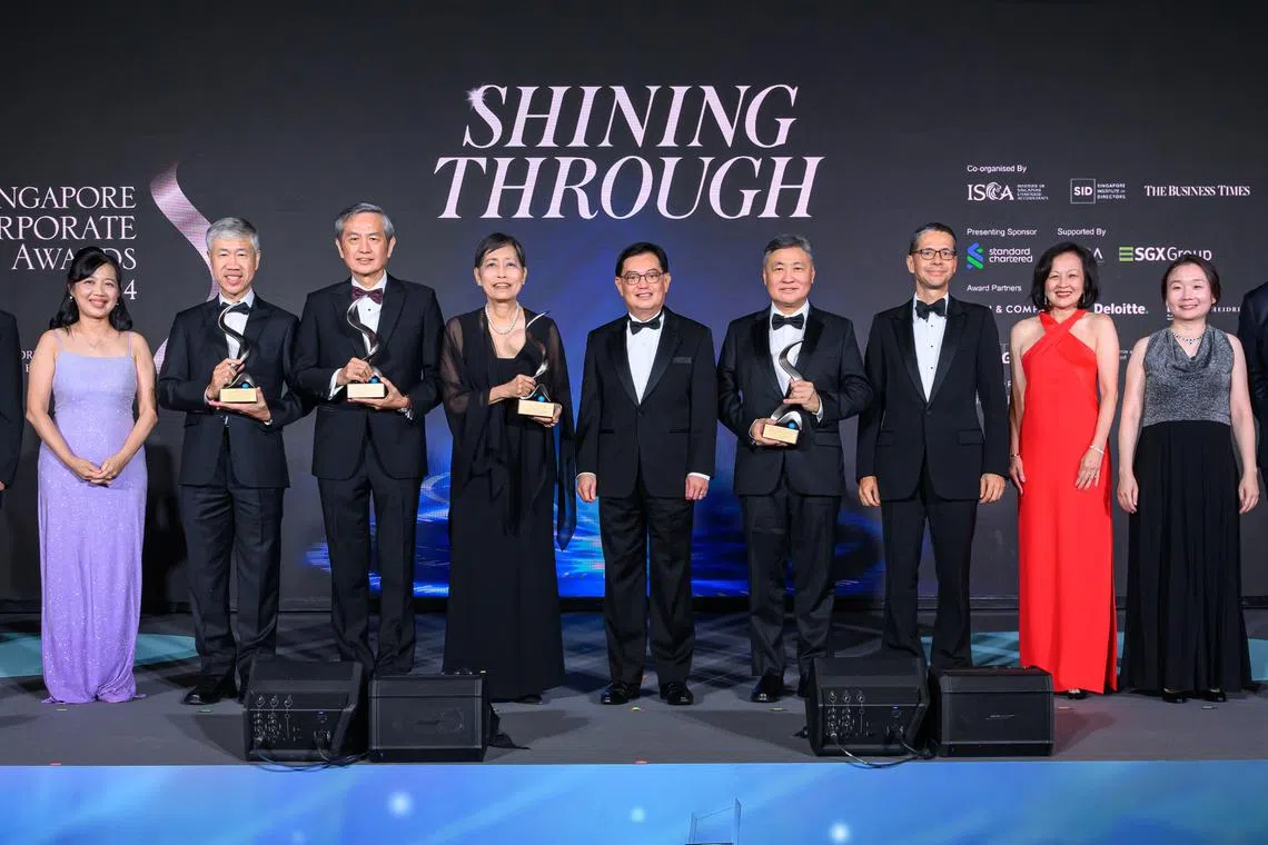 From left: Yeoh Oon Jin, SID chair; Judy Ng, Isca vice-president and SCA co-chair; Lim See Wah, chairman and CEO, Hyphens Pharma International; Stephen Ho, executive director and CEO, Hong Leong Asia; Euleen Goh, immediate past chair, Sats; guest of honour; Deputy Prime Minister Heng Swee Keat; Tow Heng Tan, chair, Sembcorp Industries; Patrick Lee, CEO, Singapore and Asean, Standard Chartered; Pauline Goh, SID second vice-chair and SCA co-chair; Chen Huifen, editor, The Business Times and SCA co-chair; and Marcus Lam, executive chair, PwC Singapore.